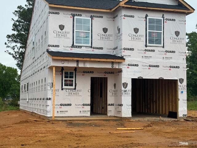 property under construction featuring a garage