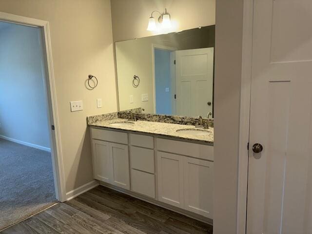 bathroom featuring vanity and hardwood / wood-style flooring