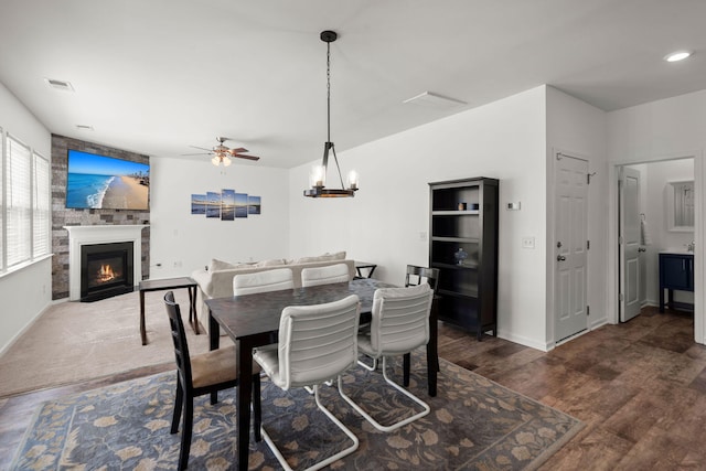 686 Redbud Ln, Summerville, SC 29486 - dining room featuring visible vents, baseboards, wood finished floors, a ceiling fan, and a glass covered fireplace