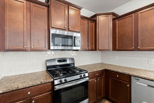 686 Redbud Ln, Summerville, SC 29486 - kitchen featuring light stone counters, decorative backsplash, and stainless steel appliances