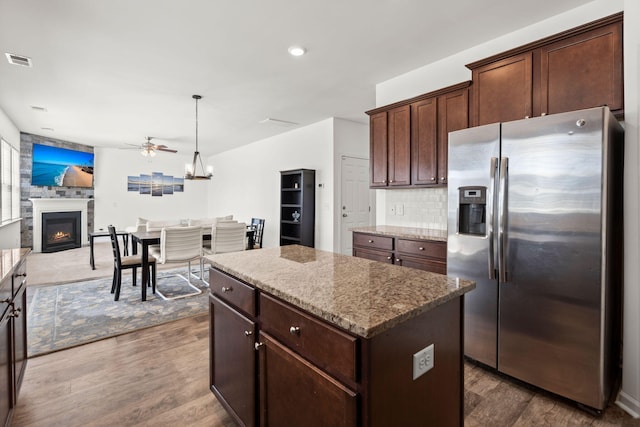 686 Redbud Ln, Summerville, SC 29486 - kitchen featuring visible vents, stainless steel refrigerator with ice dispenser, a center island, and wood finished floors