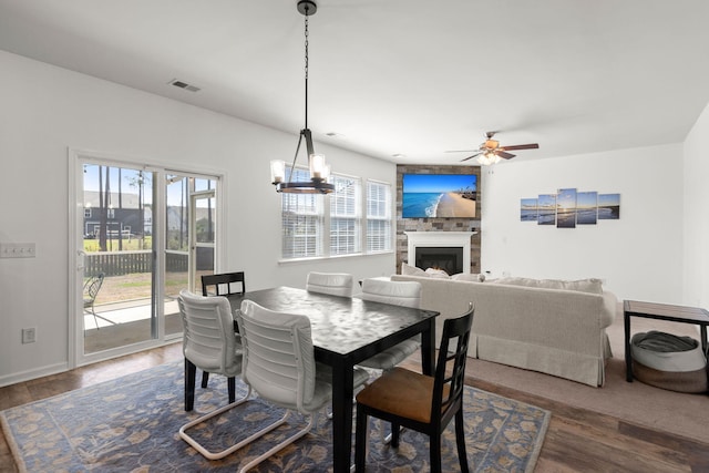 686 Redbud Ln, Summerville, SC 29486 - dining room with ceiling fan, visible vents, a fireplace, and wood finished floors