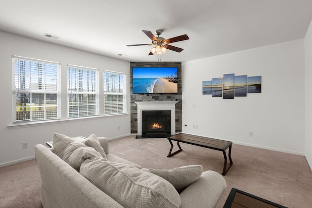 686 Redbud Ln, Summerville, SC 29486 - carpeted living area with baseboards, a fireplace, visible vents, and a ceiling fan