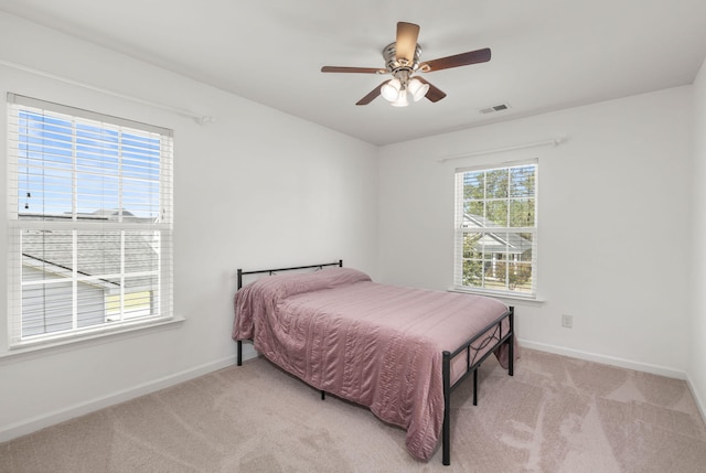 686 Redbud Ln, Summerville, SC 29486 - bedroom with light colored carpet, visible vents, baseboards, and a ceiling fan