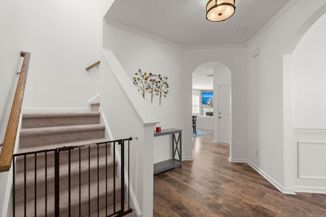 686 Redbud Ln, Summerville, SC 29486 - stairway featuring baseboards, arched walkways, crown molding, and wood finished floors