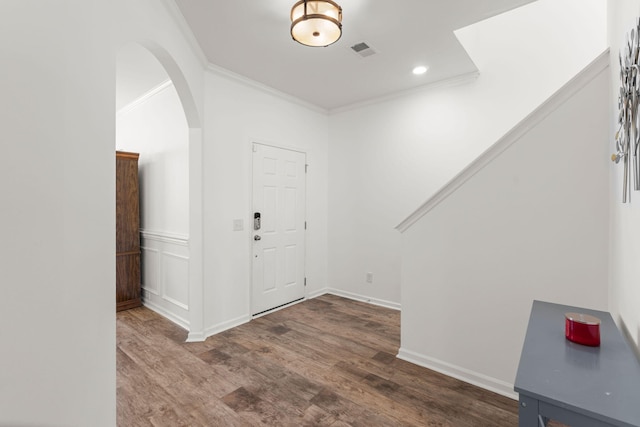 686 Redbud Ln, Summerville, SC 29486 - entryway with wood finished floors, ornamental molding, arched walkways, and visible vents