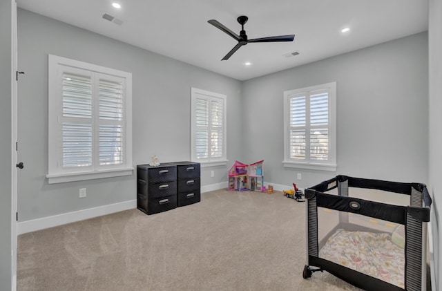 bedroom with ceiling fan and carpet flooring