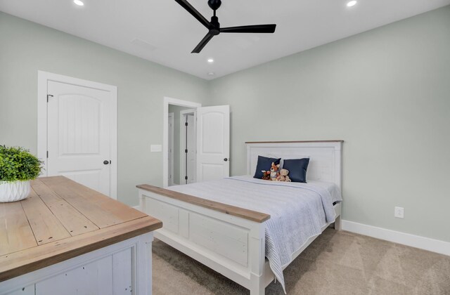 carpeted bedroom featuring ceiling fan