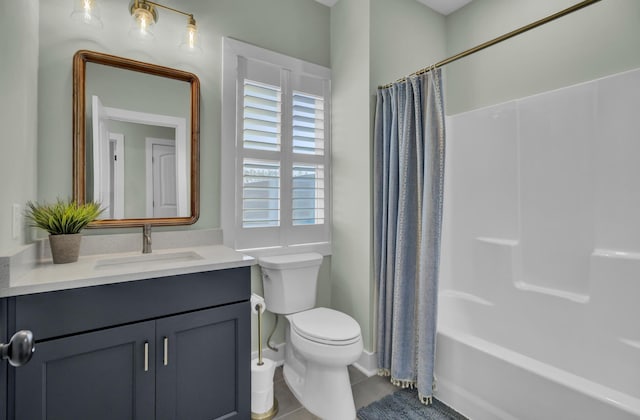 full bathroom featuring vanity, toilet, tile patterned flooring, and shower / tub combo