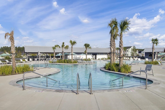 view of swimming pool with a patio area