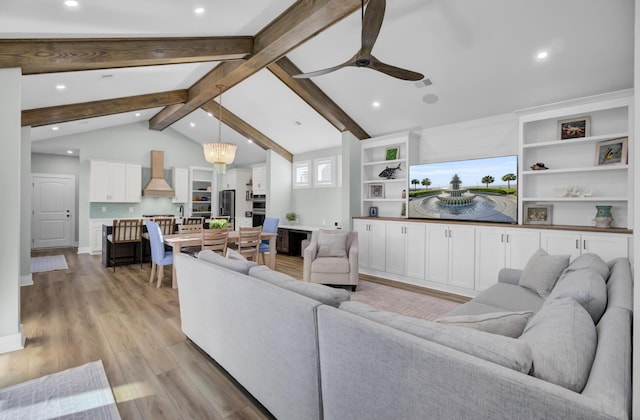 living room with beamed ceiling, ceiling fan, high vaulted ceiling, and light hardwood / wood-style floors