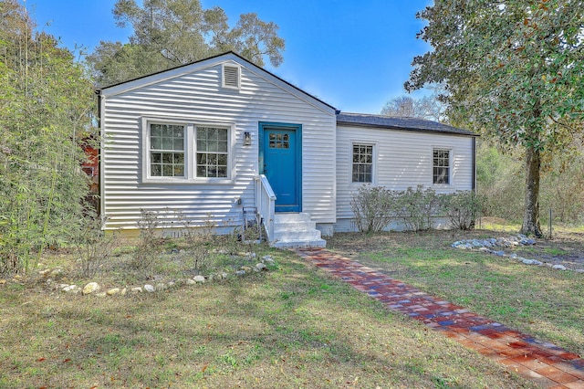 view of front of house featuring crawl space, entry steps, and a front yard