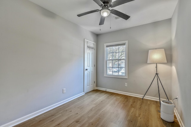 unfurnished bedroom with visible vents, baseboards, light wood-style flooring, and a ceiling fan