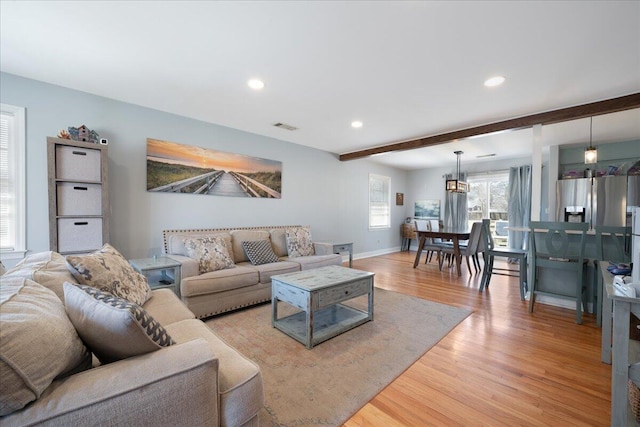 1115 O T Wallace Blvd, Moncks Corner, SC 29461 - living area featuring light wood-style flooring, beam ceiling, baseboards, and recessed lighting