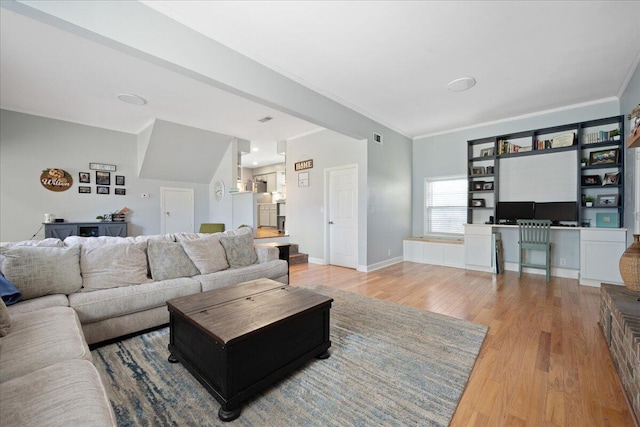 1115 O T Wallace Blvd, Moncks Corner, SC 29461 - living area featuring crown molding, light wood-style floors, and baseboards