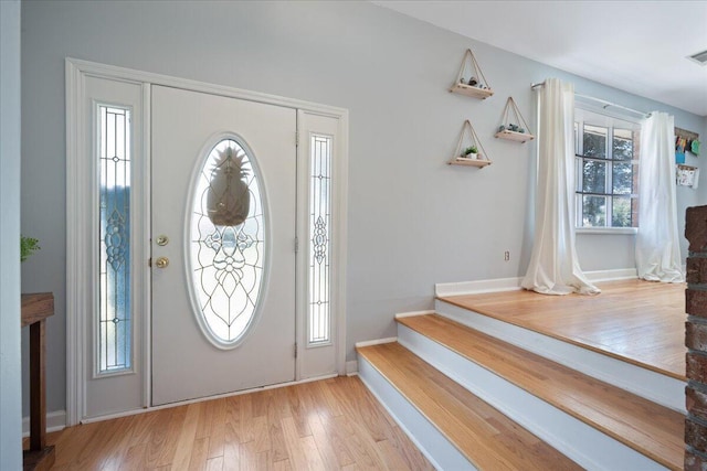 1115 O T Wallace Blvd, Moncks Corner, SC 29461 - entryway with wood finished floors, baseboards, and stairs