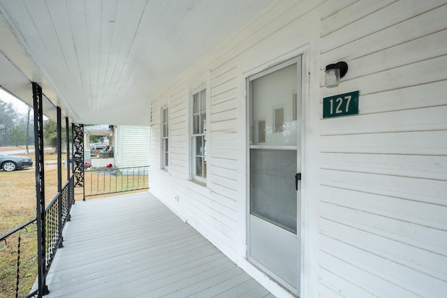 wooden terrace featuring a porch