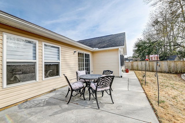 view of patio / terrace with outdoor dining area and fence