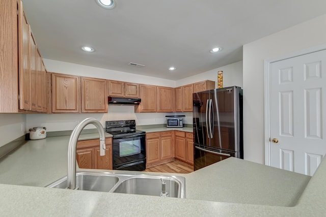 kitchen with visible vents, appliances with stainless steel finishes, light countertops, under cabinet range hood, and recessed lighting