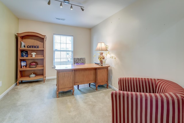 office area with track lighting, light carpet, visible vents, and baseboards