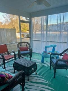 sunroom / solarium with ceiling fan