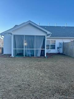 back of property featuring a sunroom