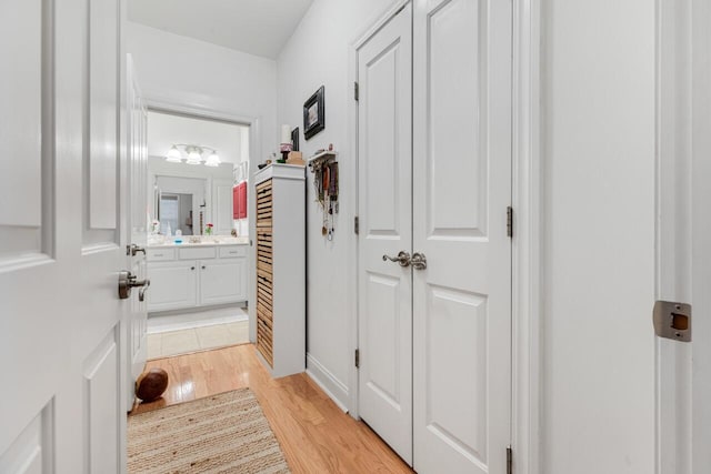 hallway with light wood-type flooring