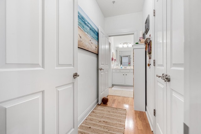 hallway featuring light wood-type flooring
