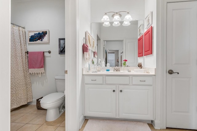 bathroom featuring vanity, tile patterned floors, toilet, and a chandelier