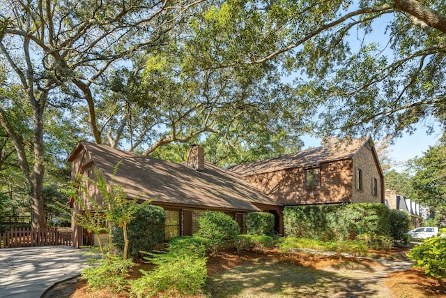810 Creekside Dr, Mount Pleasant, SC 29464 - view of front of property with fence, a chimney, and concrete driveway