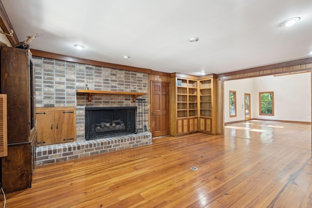 810 Creekside Dr, Mount Pleasant, SC 29464 - unfurnished living room with recessed lighting, a brick fireplace, and hardwood / wood-style flooring