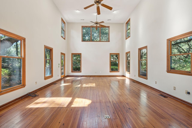 810 Creekside Dr, Mount Pleasant, SC 29464 - unfurnished living room featuring baseboards, a wealth of natural light, a ceiling fan, and visible vents