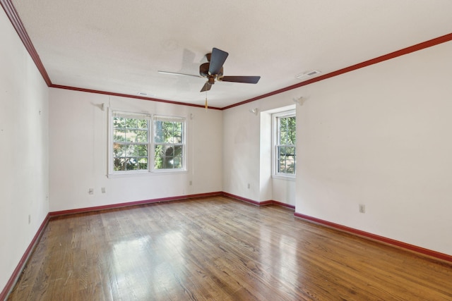 810 Creekside Dr, Mount Pleasant, SC 29464 - empty room featuring a ceiling fan, visible vents, wood finished floors, baseboards, and ornamental molding