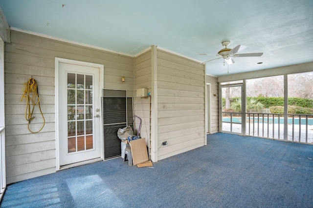 sunroom / solarium with ceiling fan