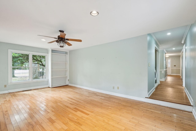 spare room with light wood-style floors, recessed lighting, baseboards, and a ceiling fan