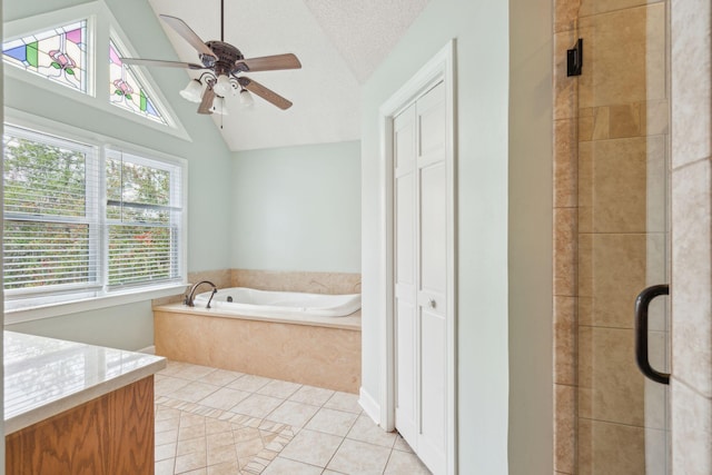 full bathroom featuring lofted ceiling, a stall shower, tile patterned flooring, and a textured ceiling