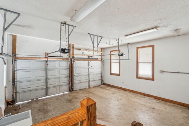 garage featuring baseboards and a garage door opener