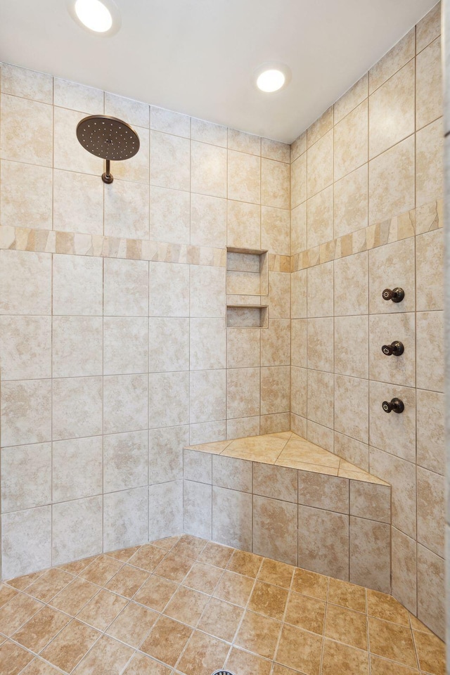 bathroom with a tile shower