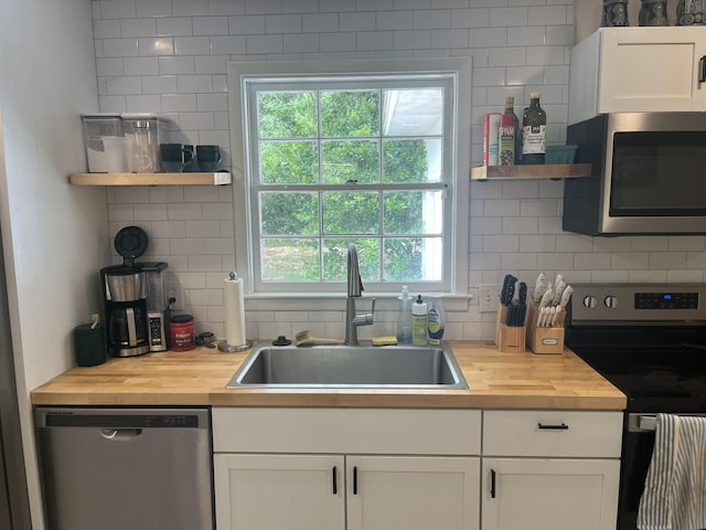 1866 Ashley Hall Rd, Charleston, SC 29407 - kitchen with butcher block counters, stainless steel appliances, a sink, and open shelves