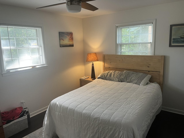 1866 Ashley Hall Rd, Charleston, SC 29407 - bedroom with multiple windows, baseboards, a ceiling fan, and wood finished floors
