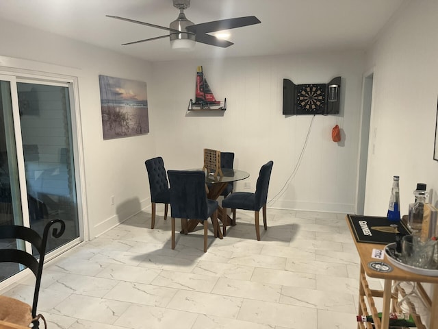 1866 Ashley Hall Rd, Charleston, SC 29407 - dining space with baseboards, a ceiling fan, and light marble finish floors