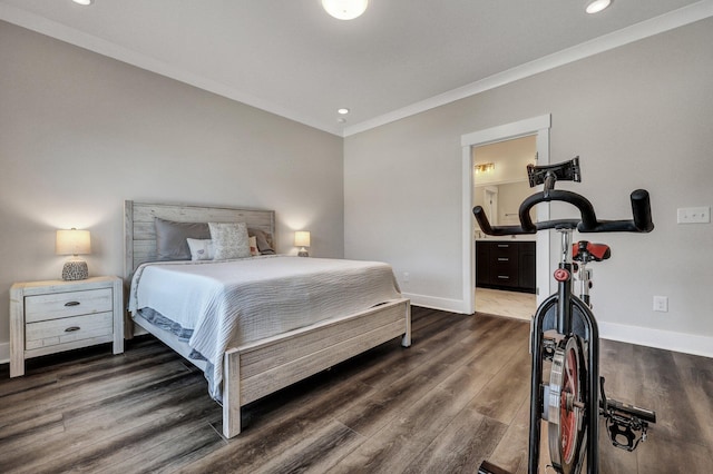 bedroom featuring ensuite bathroom, recessed lighting, dark wood-style flooring, baseboards, and ornamental molding