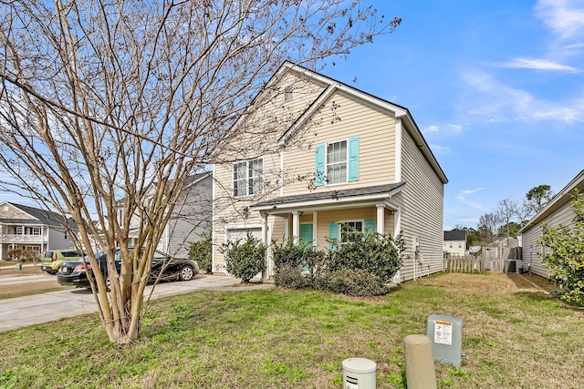 traditional-style house with fence and a front yard