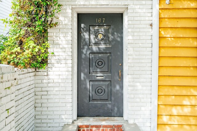167 Coming St, Charleston, SC 29403 - property entrance featuring brick siding