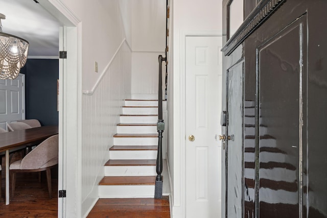 167 Coming St, Charleston, SC 29403 - stairway featuring wood finished floors and a chandelier