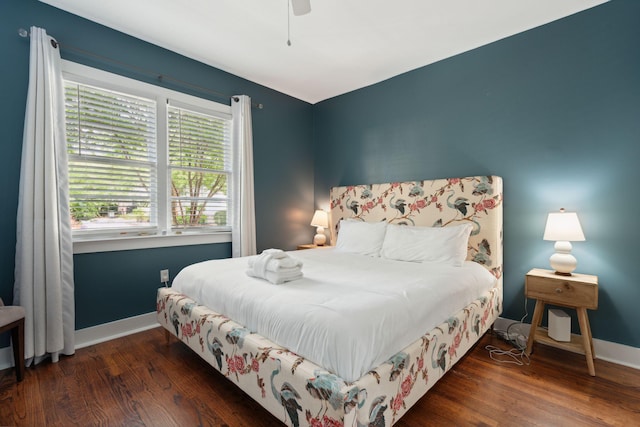 bedroom with dark wood-type flooring and ceiling fan