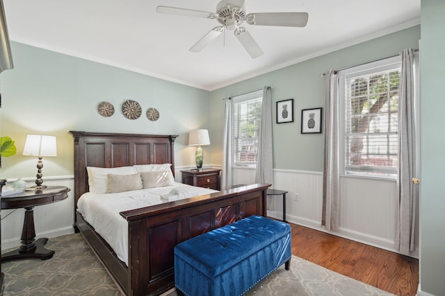 167 Coming St, Charleston, SC 29403 - bedroom with wood finished floors, a wainscoted wall, crown molding, and ceiling fan