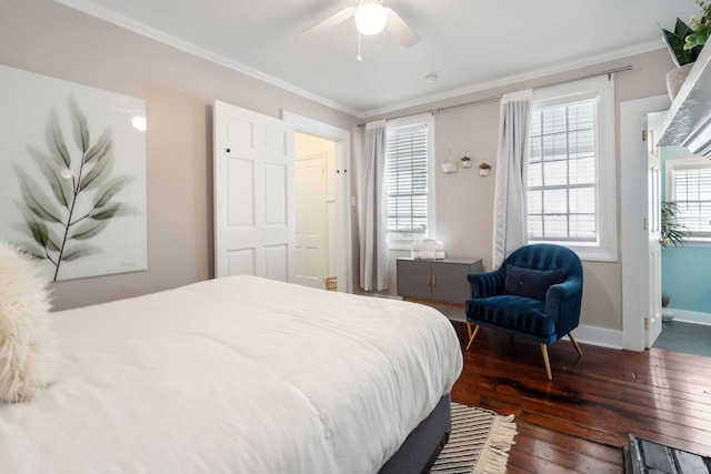 bedroom with ornamental molding, ceiling fan, and dark hardwood / wood-style flooring