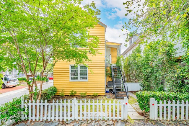 exterior space featuring driveway and a fenced front yard