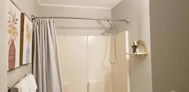 bathroom featuring walk in shower and ornamental molding